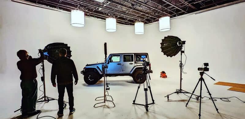 Studio crew setting up to photograph a Jeep