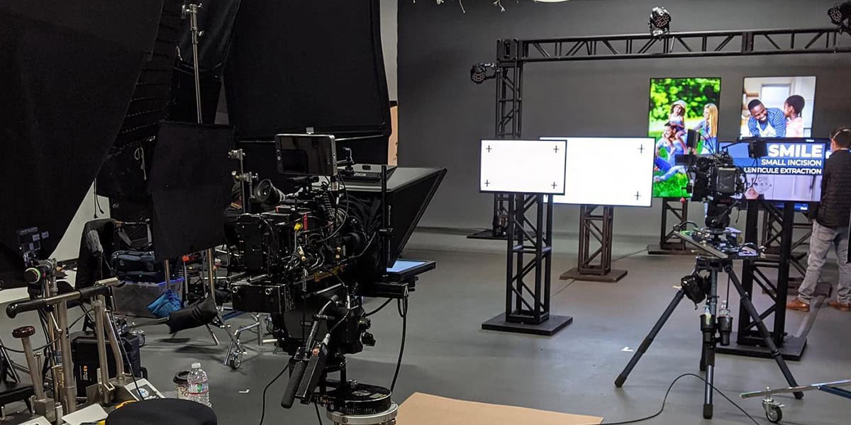 Camera setup in a professional studio ready for filming.