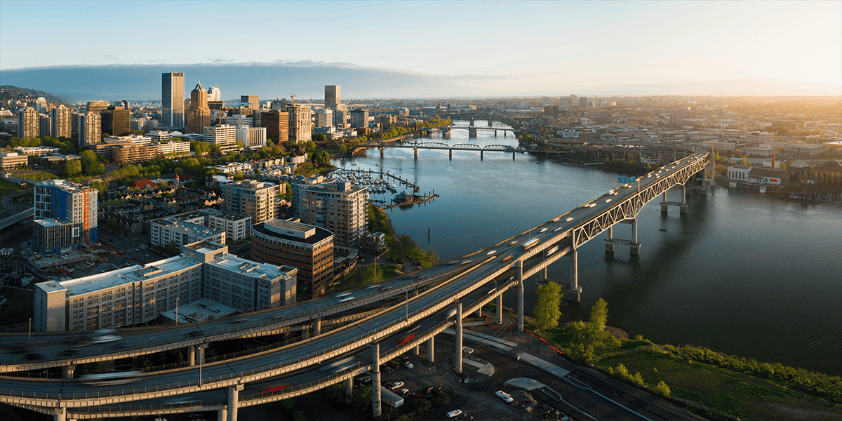 Aerial view of downtown Portland Oregon at sunrise with Willamette River bridges and Marquam freeway 